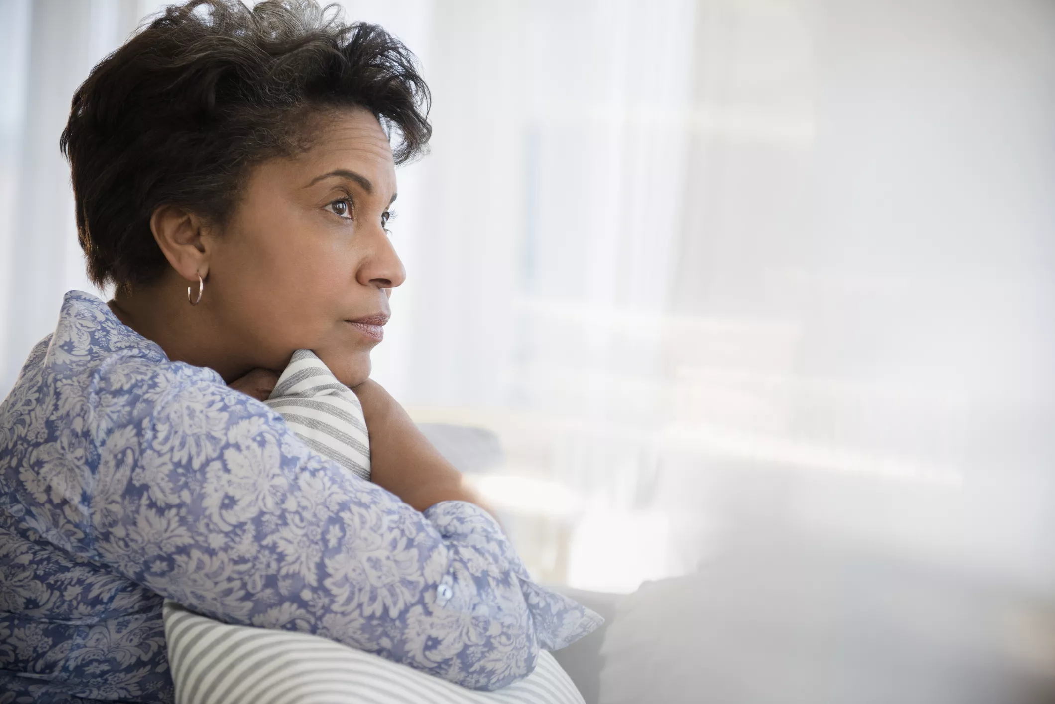 woman looking out window